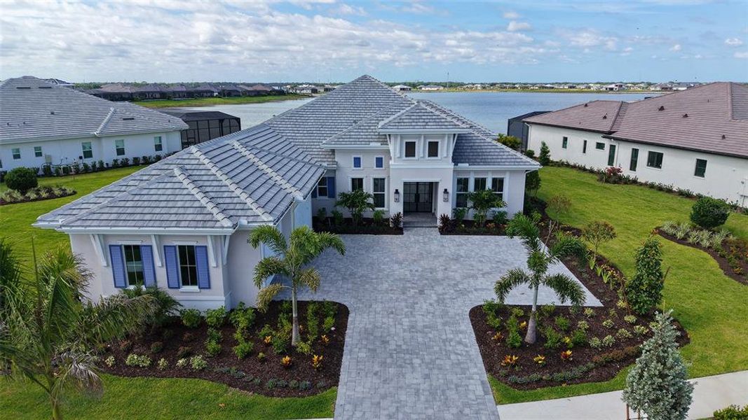 Front exterior of a new home in , Sarasota, FL, highlighting curb appeal (Image 2). Front exterior of a new home in , Sarasota, FL, highlighting curb appeal (Image 2).