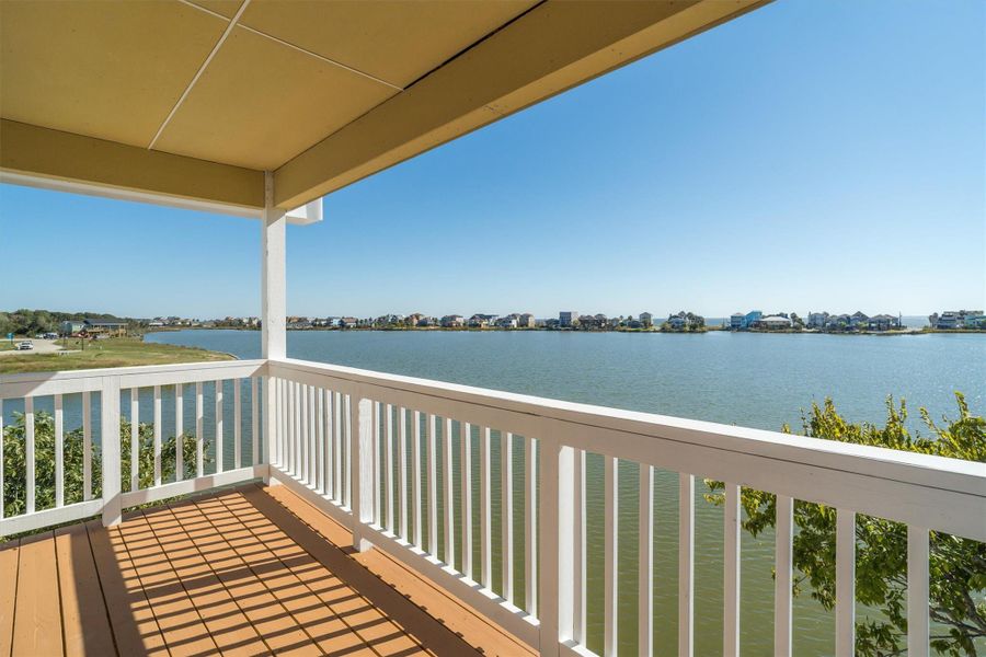 Private covered balcony right outside the primary suite Private covered balcony right outside the primary suite