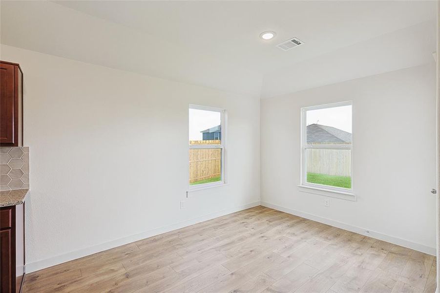 Unfurnished room featuring light wood-type flooring