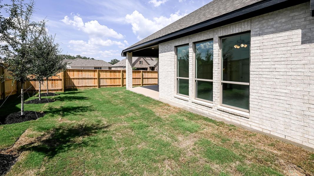 View of yard featuring a patio View of yard featuring a patio