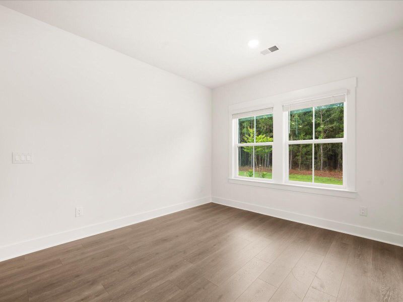 Spacious, unfurnished interior of a new home in The Coves at Lakes of Cane Bay, Summerville (Image 37). Spacious, unfurnished interior of a new home in The Coves at Lakes of Cane Bay, Summerville (Image 37).