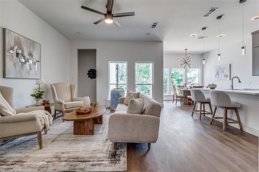 Living room with sink, ceiling fan, and hardwood / wood-style floors