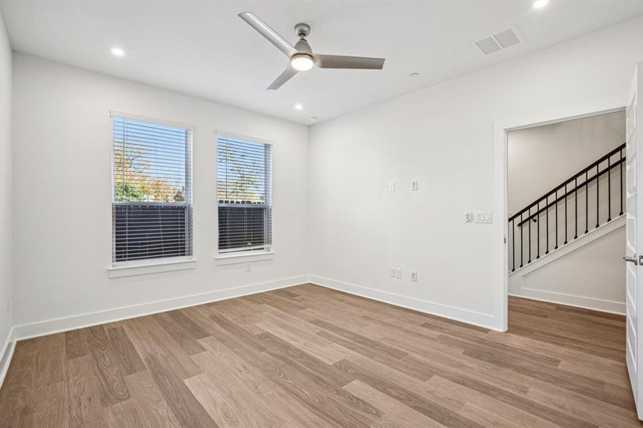 The primary bedroom sits on theentry level, offering a quietretreat or can easily betransformed into a private officeor studio space. (Sample photoof finishes and layout)