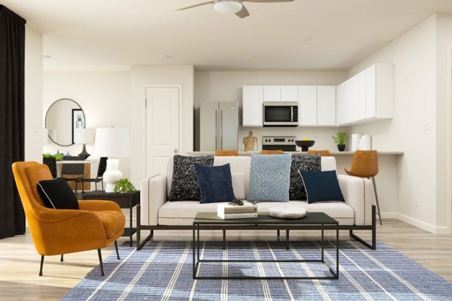 A living room with a couch and a table. A living room with a couch and a table.