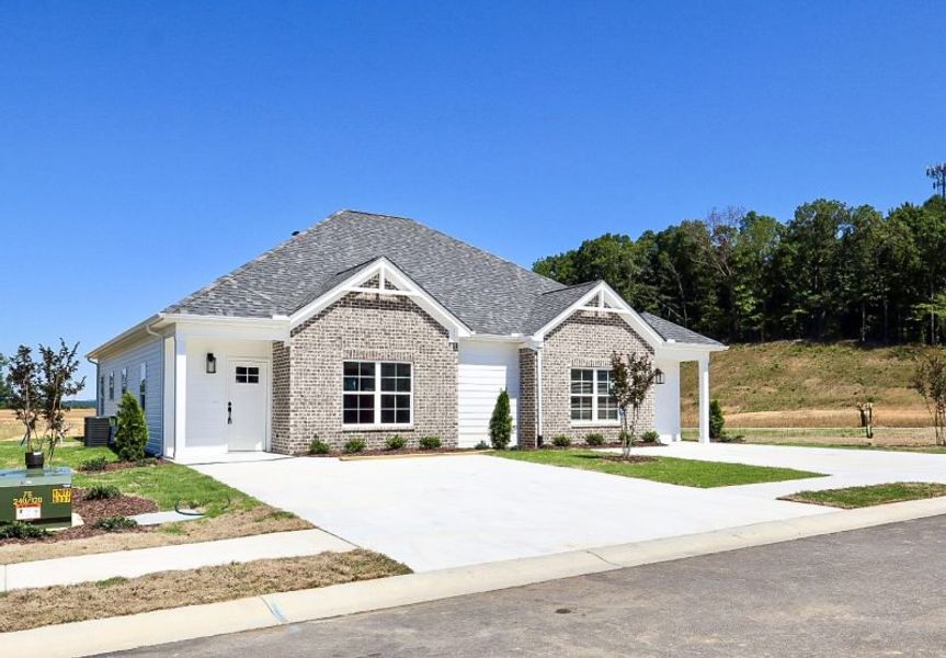 Front exterior of a new home in The Hoback, Cleveland, TN, highlighting curb appeal (Image 24). Front exterior of a new home in The Hoback, Cleveland, TN, highlighting curb appeal (Image 24).
