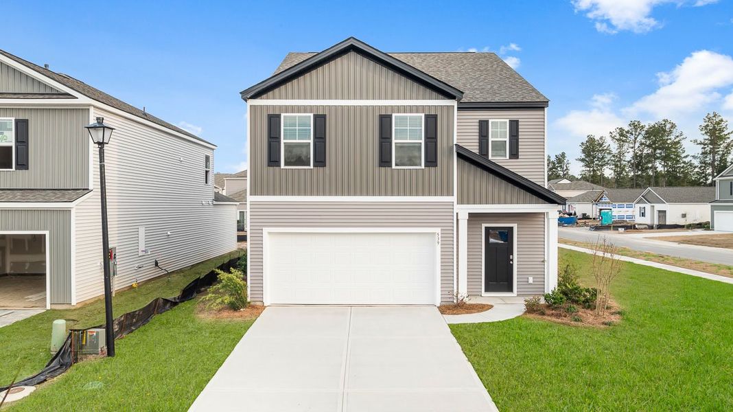 Representative exterior photo of a completed home built from the Robie by D.R. Horton in Pineview North, Summerville, SC (Image 1). Representative exterior photo of a completed home built from the Robie by D.R. Horton in Pineview North, Summerville, SC (Image 1).