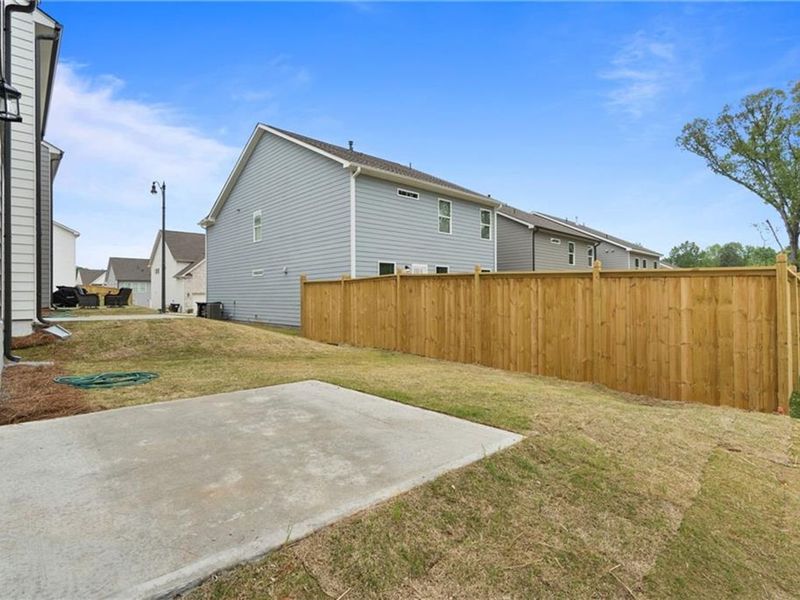 Exterior details and patio area of a home in The Village at Shallowford, Kennesaw (Image 2).