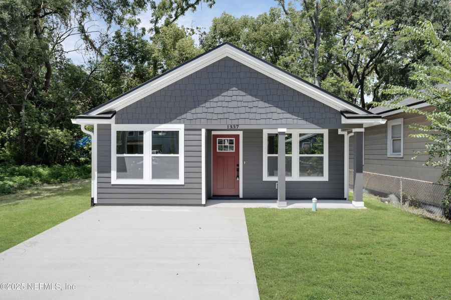 Front exterior of a new home in , Jacksonville, FL, highlighting curb appeal (Image 13). Front exterior of a new home in , Jacksonville, FL, highlighting curb appeal (Image 13).