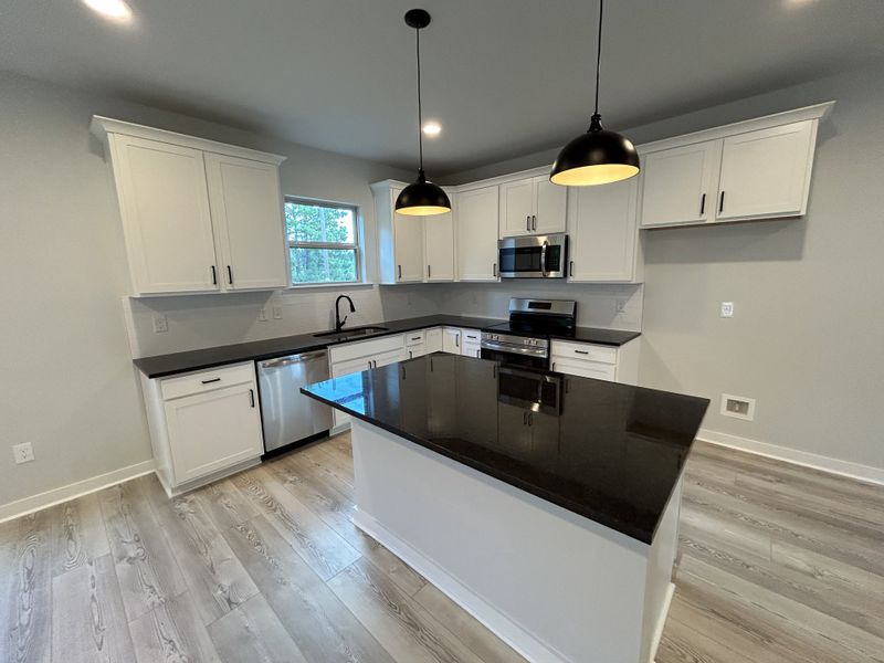 Furnished interior view inside a new home in Hickory Cove, Burns (Image 8).