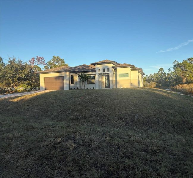 Exterior details and patio area of a home in , Lehigh Acres (Image 2). Exterior details and patio area of a home in , Lehigh Acres (Image 2).