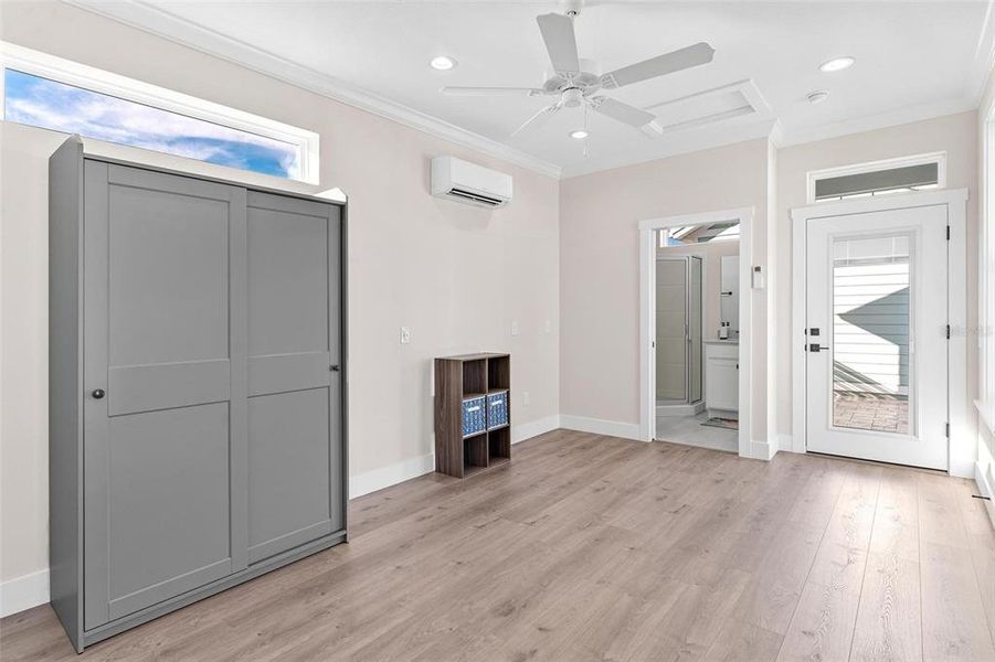 Cottage Living/Bedroom with Laminate Plank Flooring