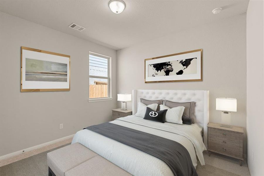 Your secondary bedroom features plush carpet, fresh paint, closet, and a large window that lets in plenty of natural lighting.