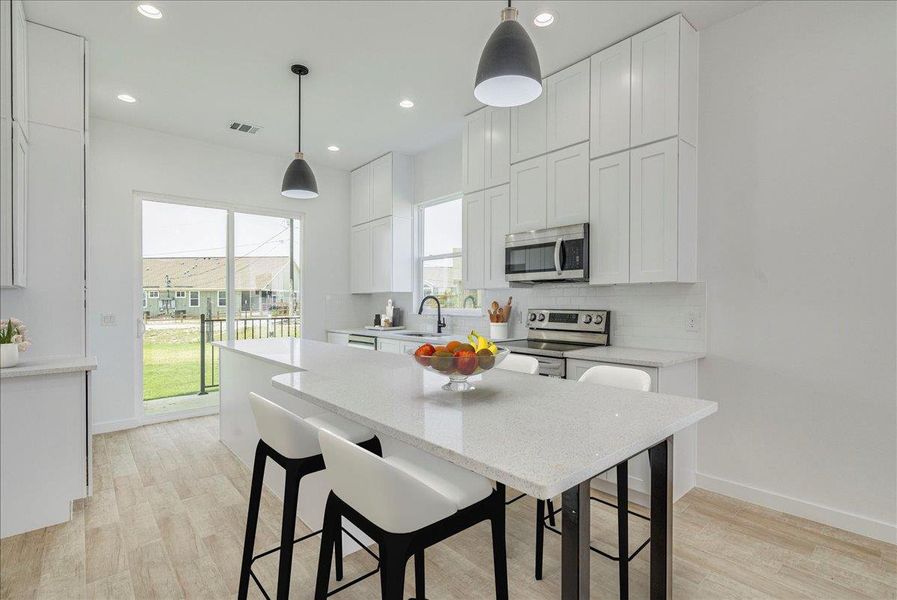 Open kitchen with eat in countertop Open kitchen with eat in countertop