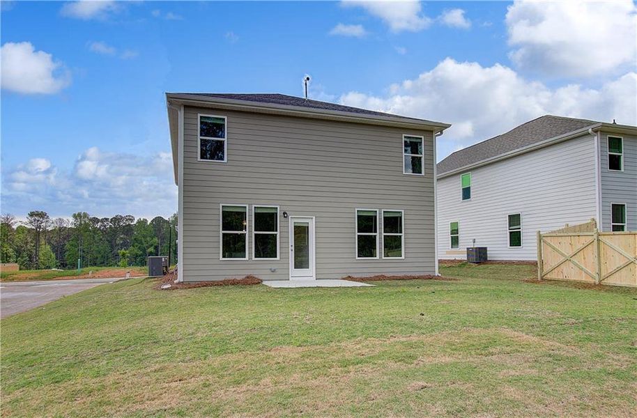 Exterior details and patio area of a home in Enclave at Evergreen, Fairburn (Image 4).