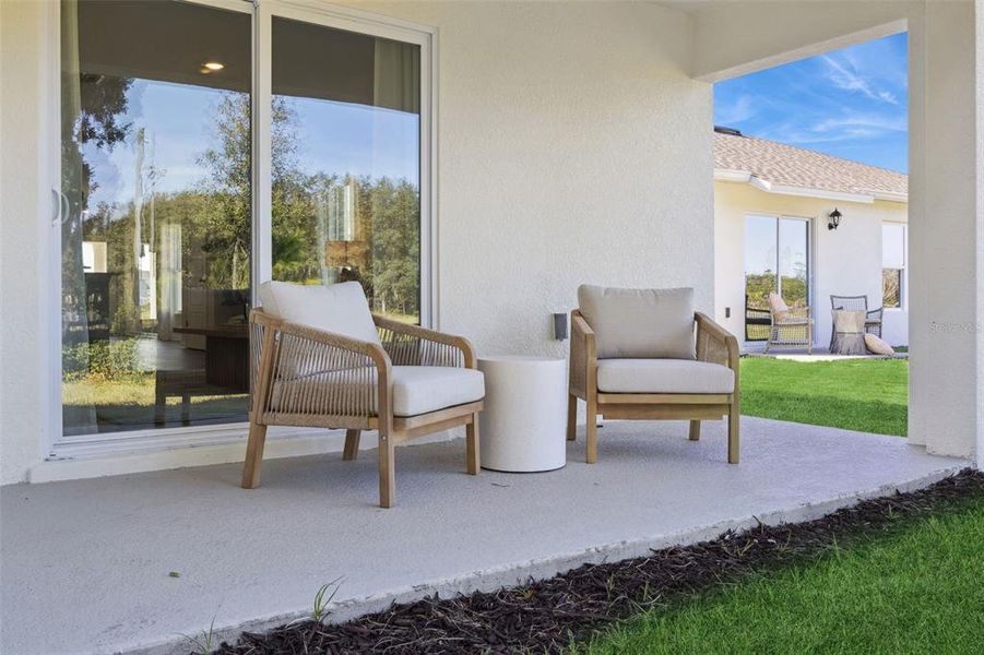 Exterior details and patio area of a home in Avalon Park Tavares, Tavares (Image 2).