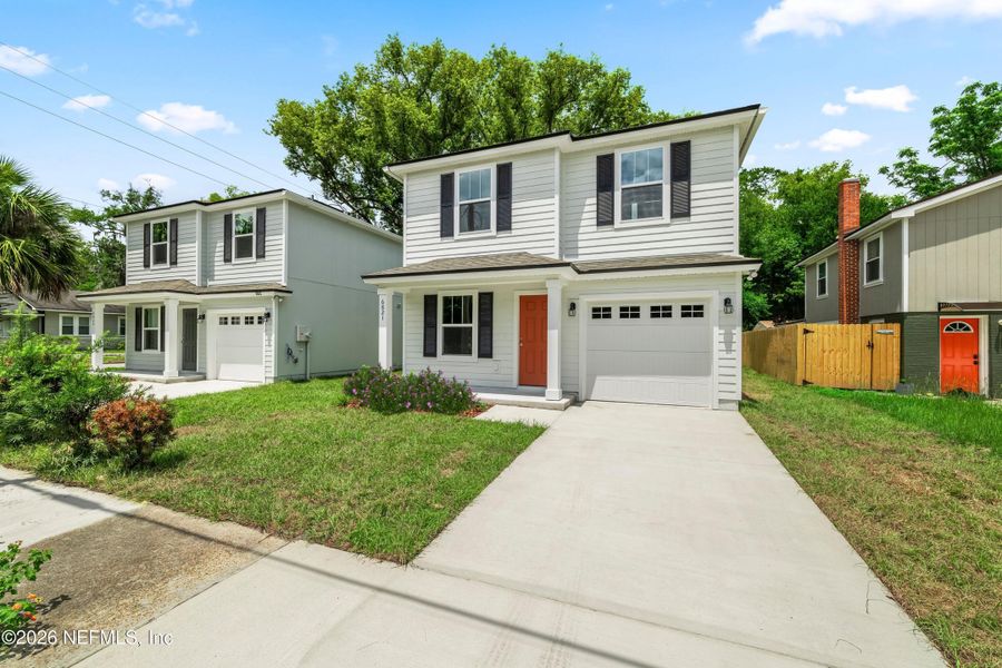 Front exterior of a new home in , Jacksonville, FL, highlighting curb appeal (Image 20). Front exterior of a new home in , Jacksonville, FL, highlighting curb appeal (Image 20).