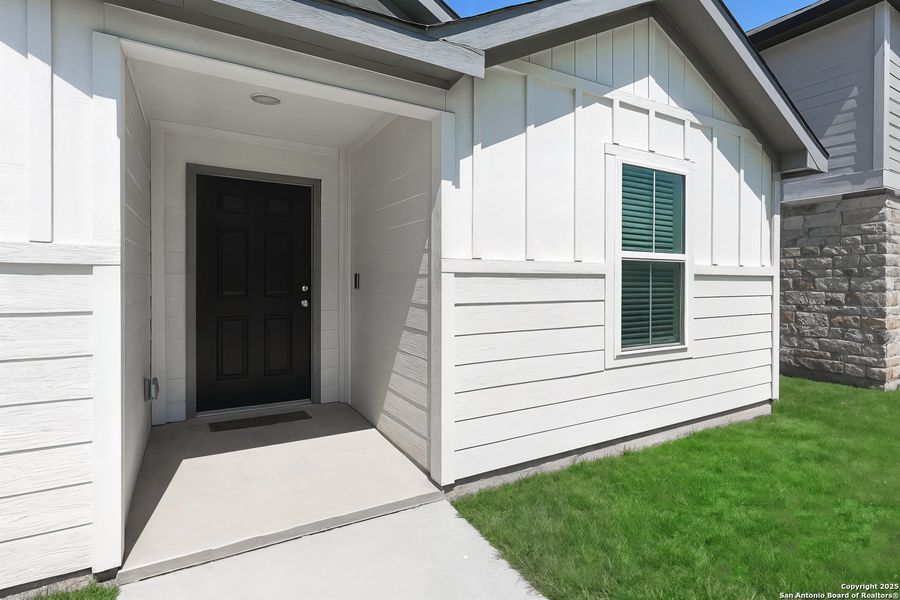 Front exterior of a new home in Vista Real, Converse, TX, highlighting curb appeal (Image 2).