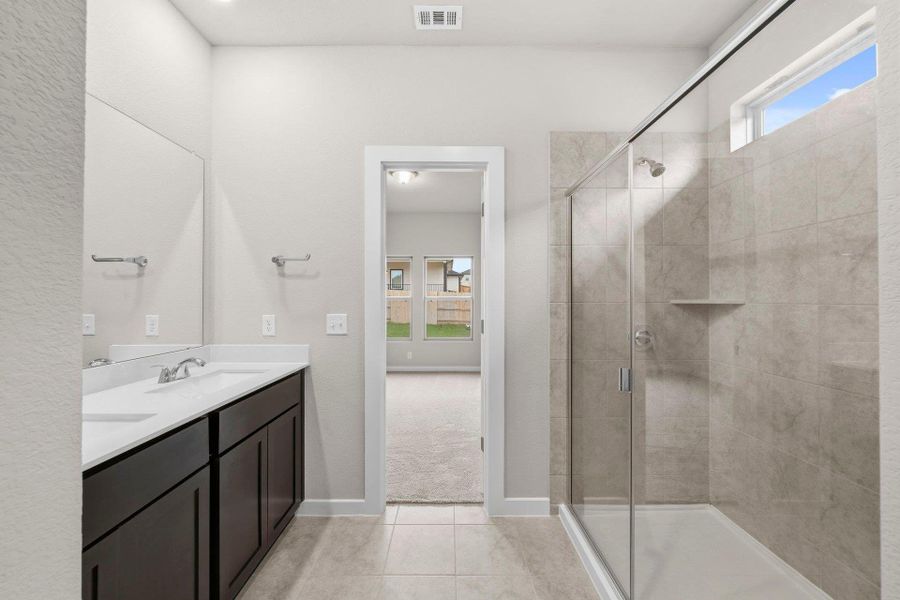 Primary Bath retreat with dual vanities & walk-in shower