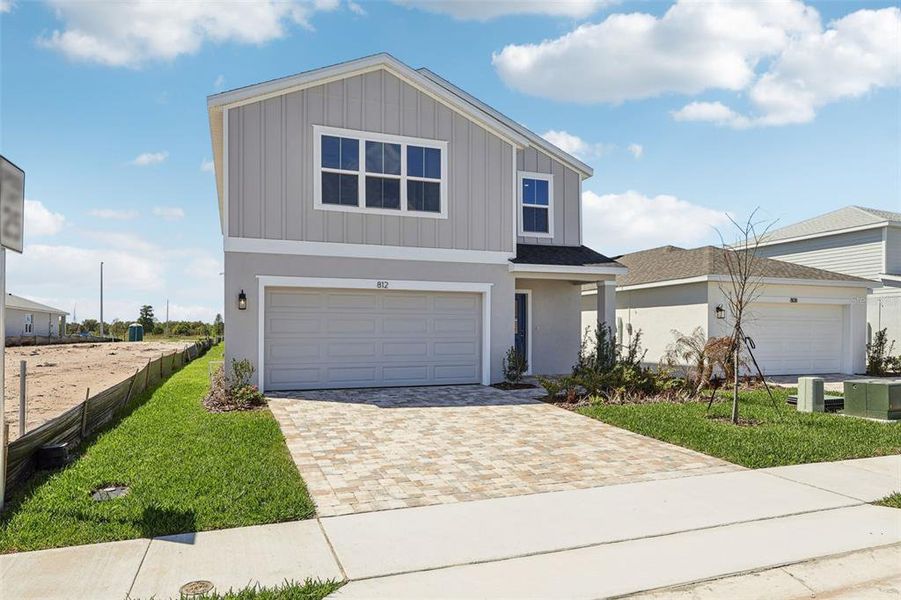 Front exterior of a new home in Willowbrook North, Winter Haven, FL, highlighting curb appeal (Image 20). Front exterior of a new home in Willowbrook North, Winter Haven, FL, highlighting curb appeal (Image 20).