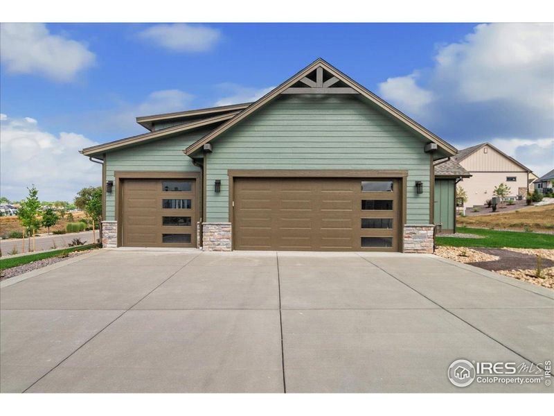 Front exterior of a new home in , Berthoud, CO, highlighting curb appeal (Image 2).
