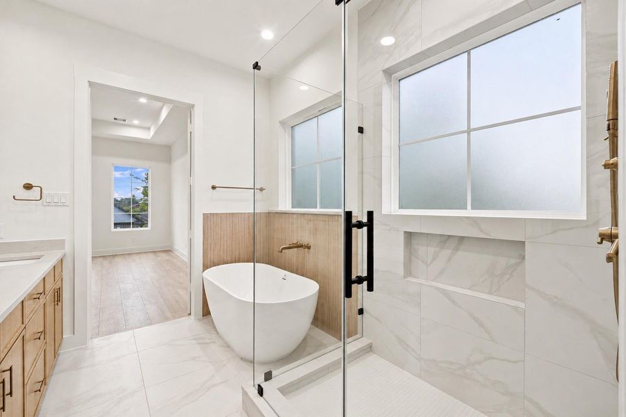 Expansive walk-in shower in the primary bathroom.