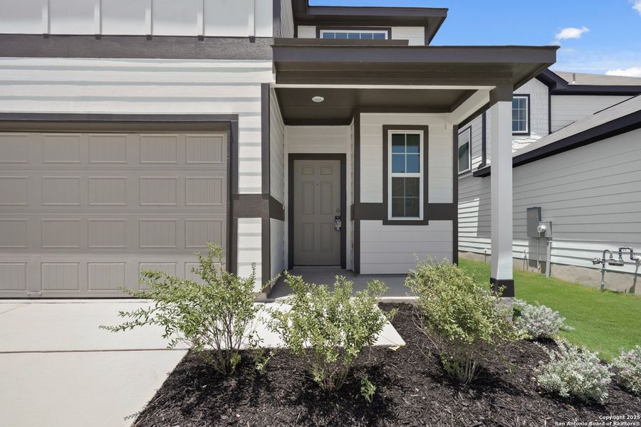 Front exterior of a new home in Timber Creek, San Antonio, TX, highlighting curb appeal (Image 23).