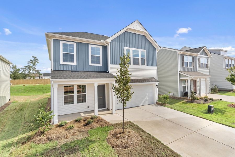 Front exterior of a new home in Mayfair Village, Spartanburg, SC, highlighting curb appeal (Image 2). Front exterior of a new home in Mayfair Village, Spartanburg, SC, highlighting curb appeal (Image 2).