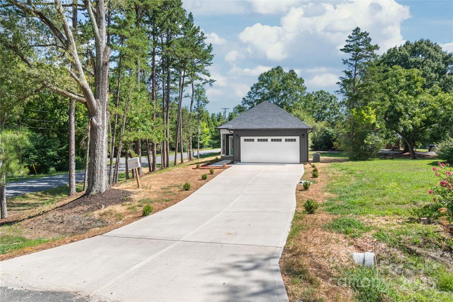 Front exterior of a new home in , Concord, NC, highlighting curb appeal (Image 19). Front exterior of a new home in , Concord, NC, highlighting curb appeal (Image 19).