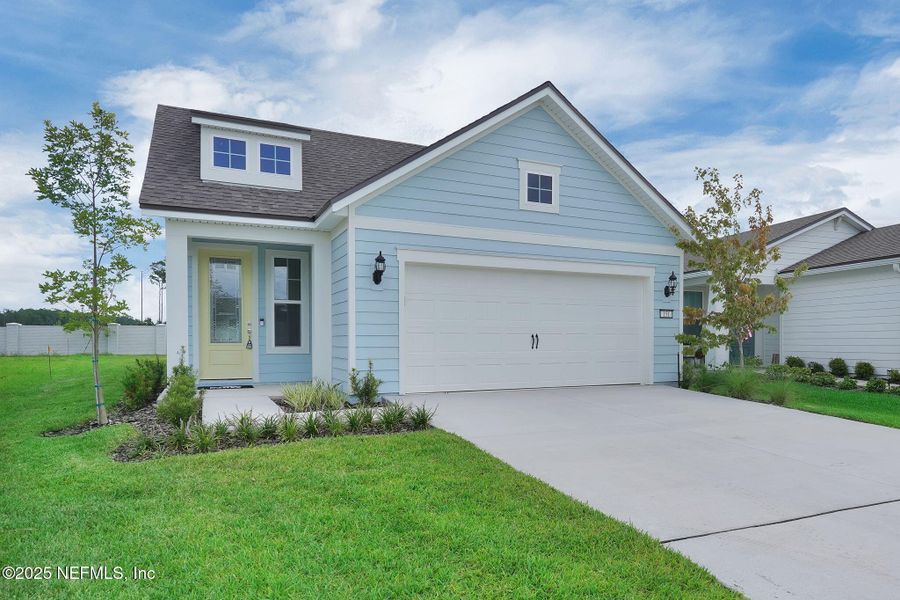Front exterior of a new home in Summer Bay at Grand Oaks, St. Augustine, FL, highlighting curb appeal (Image 19). Front exterior of a new home in Summer Bay at Grand Oaks, St. Augustine, FL, highlighting curb appeal (Image 19).