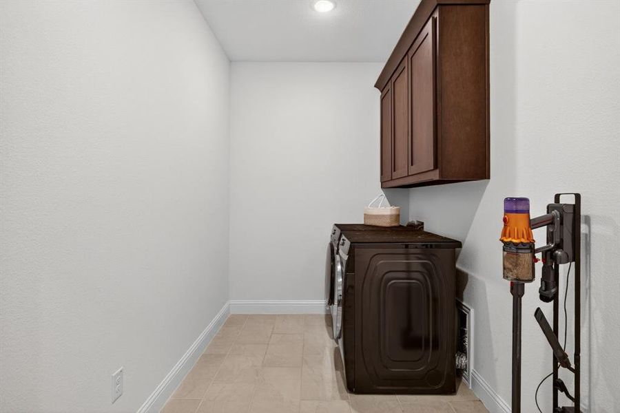 Laundry room with upper cabinetry and (not pictured) a great mud area with hooks and a bench. Laundry room with upper cabinetry and (not pictured) a great mud area with hooks and a bench.