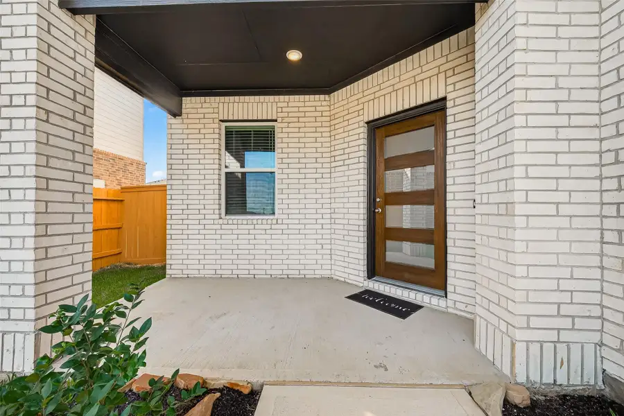 Exterior details and patio area of a home in Sunterra, Katy (Image 3). Exterior details and patio area of a home in Sunterra, Katy (Image 3).