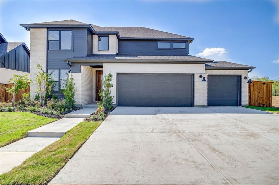 Front exterior of a new home in Pecan Grove, Burleson, TX, highlighting curb appeal (Image 1).