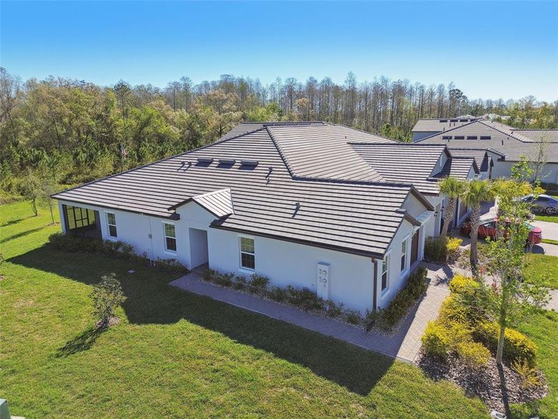Front exterior of a new home in Angeline Active Adult, Land O' Lakes, FL, highlighting curb appeal (Image 23).