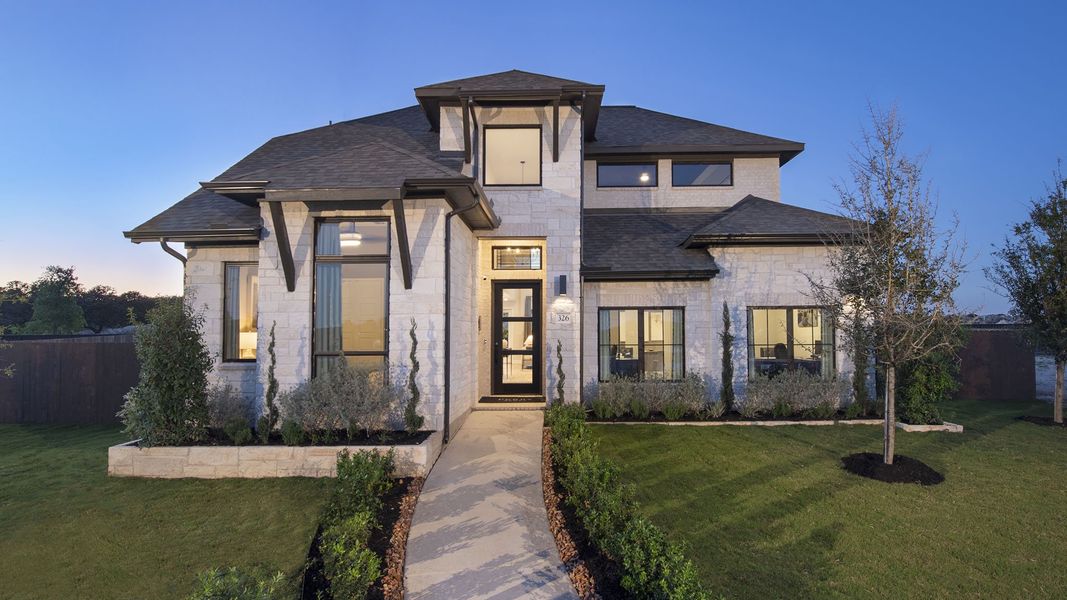 Front exterior of a new home in Parkside on the River West, Georgetown, TX, highlighting curb appeal (Image 19).