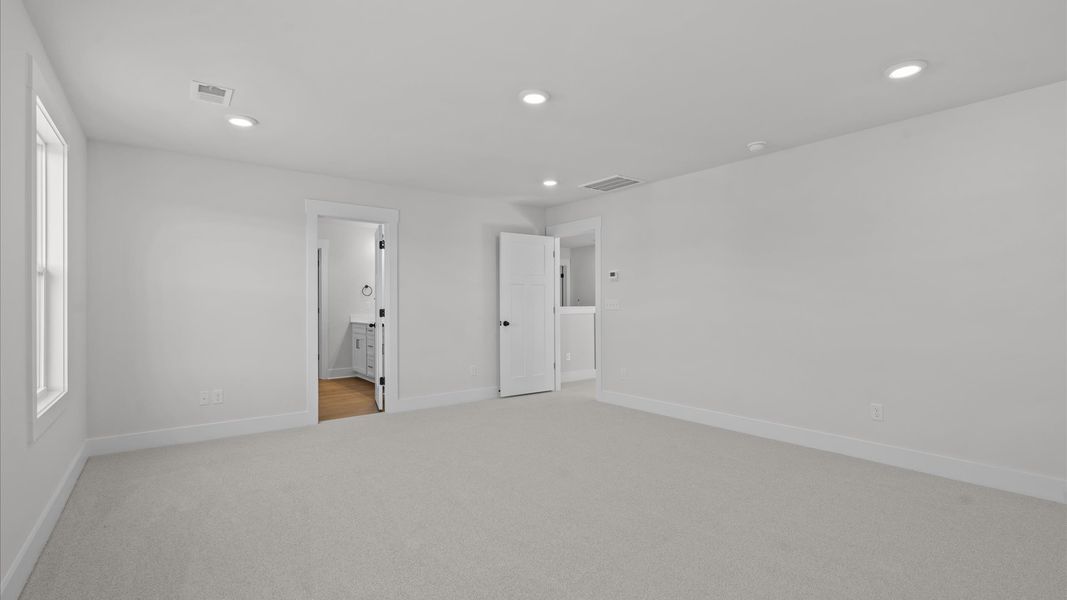 Primary suite that offers first-rate relaxation with established style and elevated finishes Primary suite that offers first-rate relaxation with established style and elevated finishes