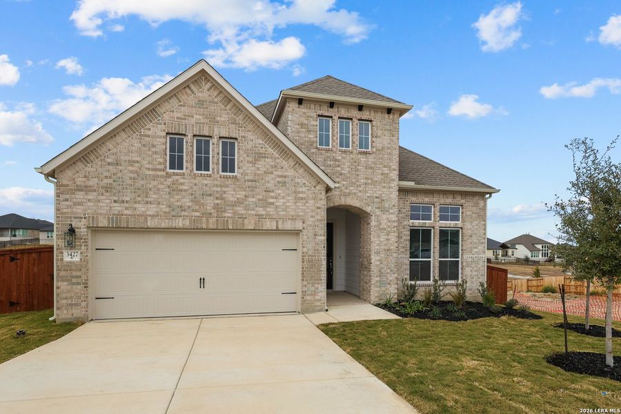 Front exterior of a new home in Homestead, Schertz, TX, highlighting curb appeal (Image 23).
