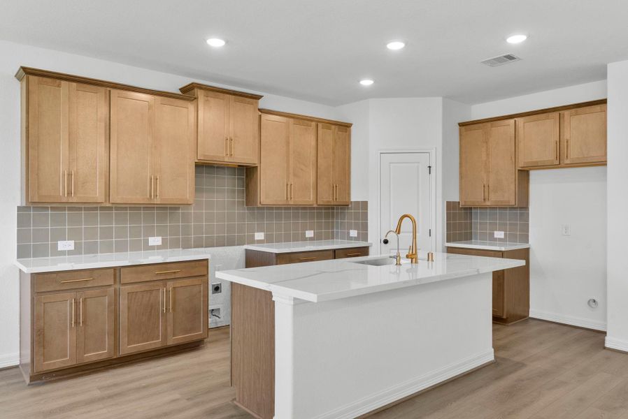 Kitchen has large island and Walk in Pantry