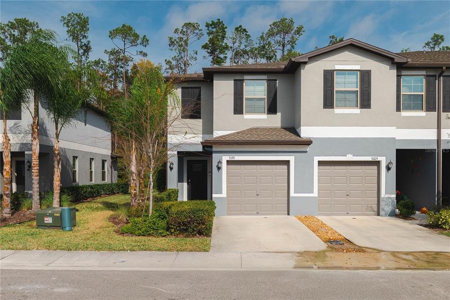 Front exterior of a new home in , Holiday, FL, highlighting curb appeal (Image 20).