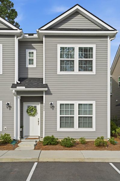 Front exterior of a new home in , Wando, SC, highlighting curb appeal (Image 1). Front exterior of a new home in , Wando, SC, highlighting curb appeal (Image 1).
