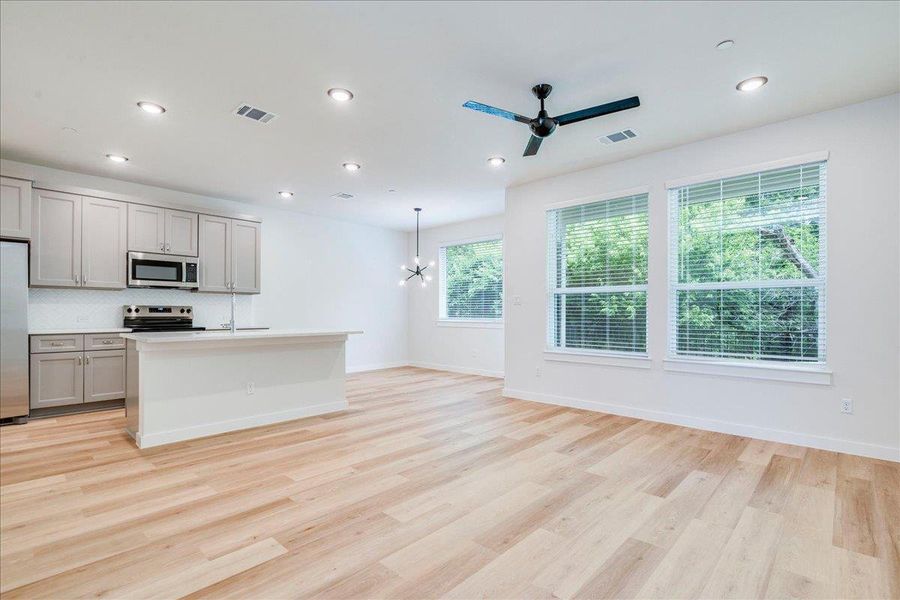 Natural light pours into this open-concept kitchen and living area, perfect for entertaining.