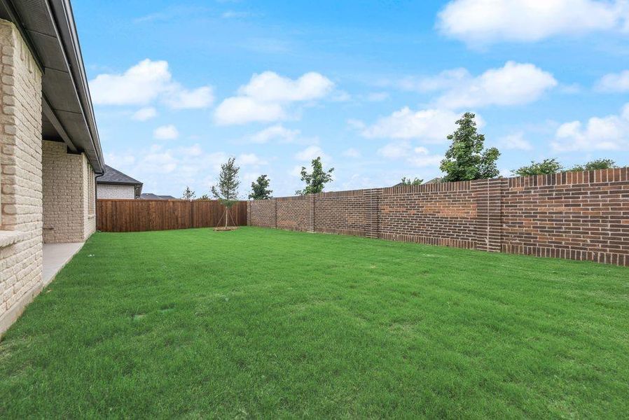 Exterior details and patio area of a home in Valencia On The Lake, Little Elm (Image 25).