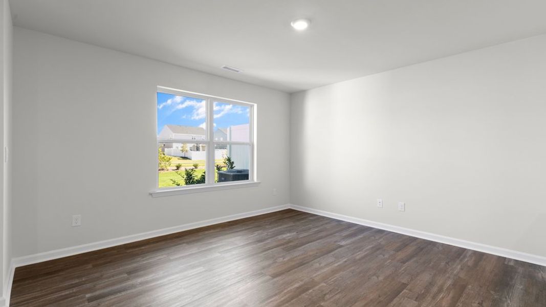 Spacious, unfurnished interior of a new home in The Townes at Belle Grove, Wendell (Image 15).