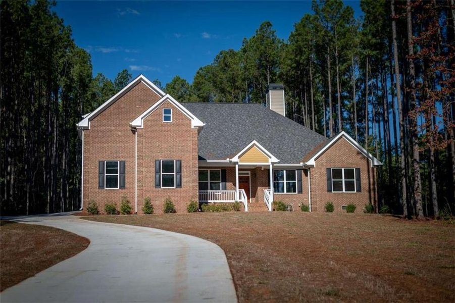 Front exterior of a new home in , Mansfield, GA, highlighting curb appeal (Image 27).