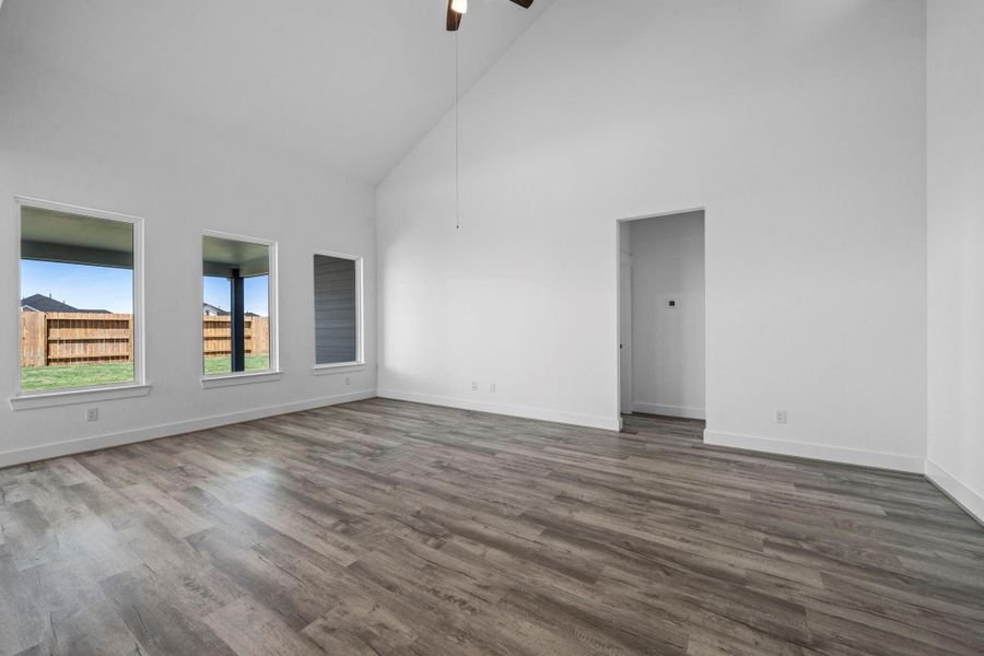 Imagine walking into a home that feels as expansive as it is inviting, bathed in natural light and framed by soaring ceilings that make every moment feel grand.