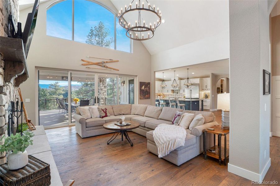 Open living space connects the living room to the kitchen, dining area, and office.