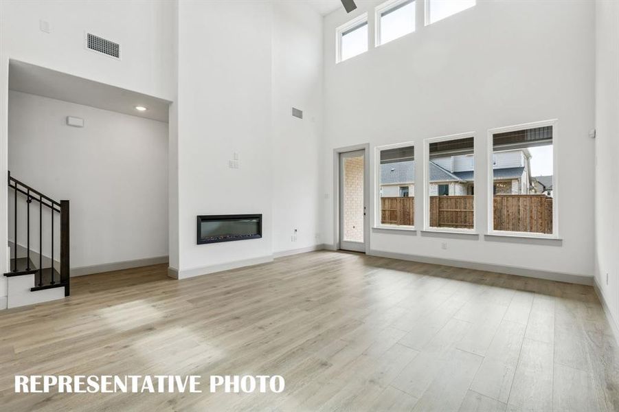 Light filled and inviting, this spacious family room is the perfect place for you to host family gatherings.  REPRESENTATIVE PHOTO