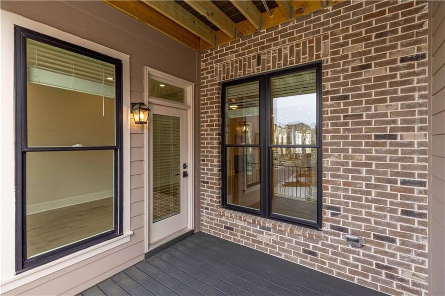 Image is of another previously built home showing the back covered deck space off the sunroom on the main level. Image is of another previously built home showing the back covered deck space off the sunroom on the main level.