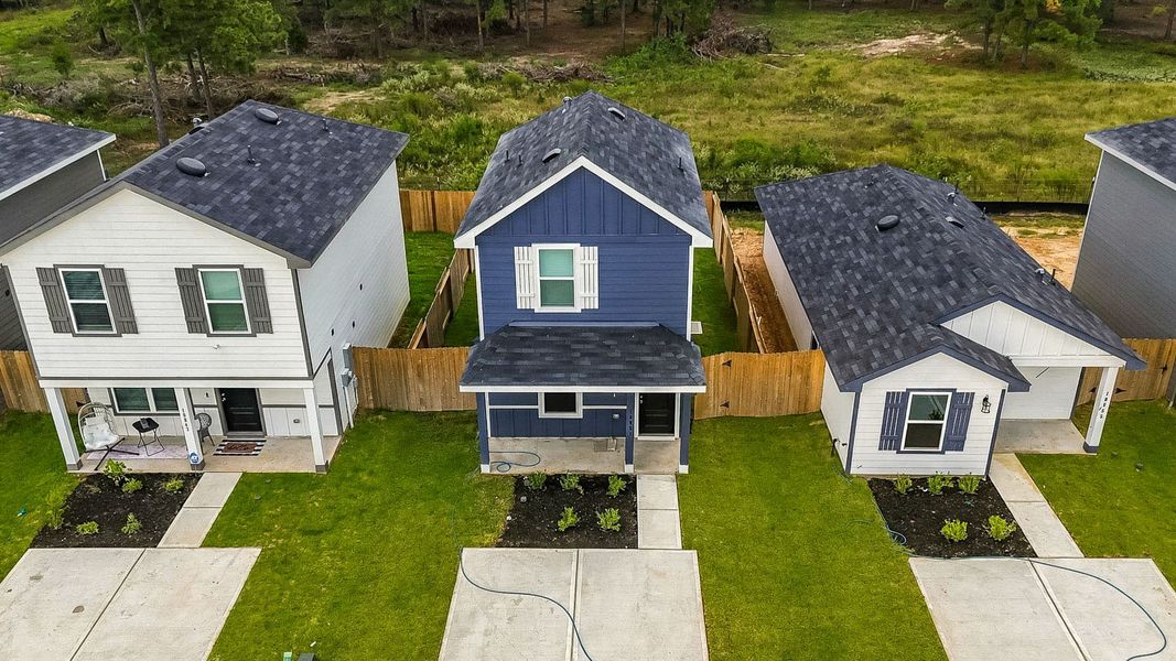 Front exterior of a new home in Baron Village, Conroe, TX, highlighting curb appeal (Image 15).
