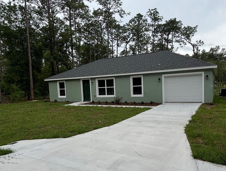 Front exterior of a new home in , Dunnellon, FL, highlighting curb appeal (Image 1). Front exterior of a new home in , Dunnellon, FL, highlighting curb appeal (Image 1).