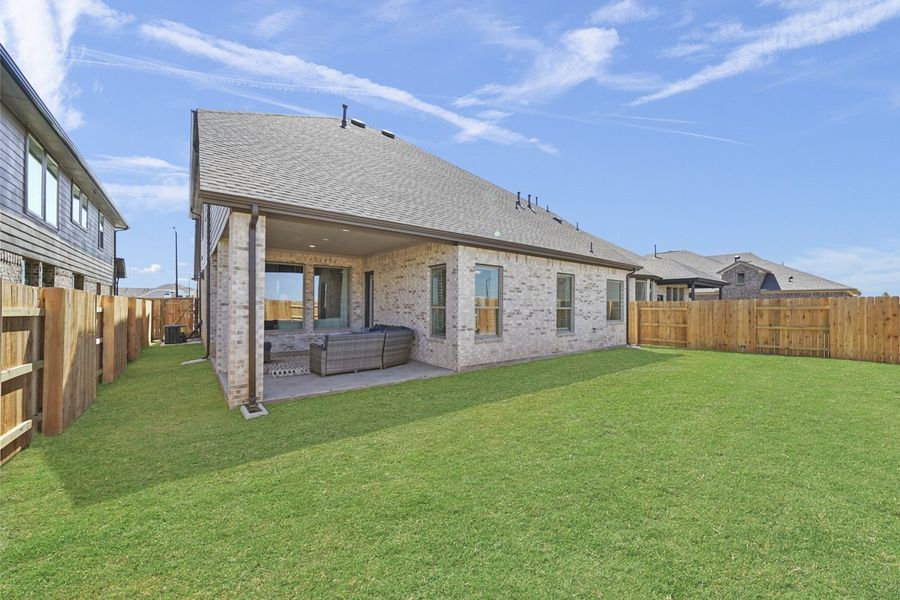 Exterior details and patio area of a home in Wood Leaf Reserve, Tomball (Image 26).